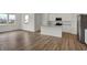 Open concept kitchen with white cabinets, stainless steel appliances, and hardwood floors at 4372 Pine Bluff Dr, Bargersville, IN 46106