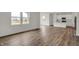 Bright living room with hardwood floors, natural light, and an open layout to the kitchen at 4372 Pine Bluff Dr, Bargersville, IN 46106
