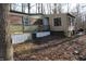 Exterior view of manufactured home showing side of building and yard at 4478 W County Road 125 S, Greencastle, IN 46135