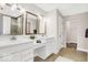 Bathroom with double sinks, quartz counters and framed mirrors at 4777 E Summerfield Dr, Camby, IN 46113