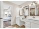 Bright bathroom featuring double vanity, modern fixtures, and access to the main bedroom at 4777 E Summerfield Dr, Camby, IN 46113