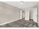 Bedroom featuring neutral walls and carpet flooring, adjoining open doors to another room at 4777 E Summerfield Dr, Camby, IN 46113