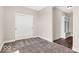 Bedroom featuring carpet flooring, a sliding closet door, and a hall tree cubby at 4777 E Summerfield Dr, Camby, IN 46113
