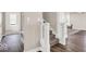 View of the foyer showcasing wood flooring and staircase leading to the upper level at 4777 E Summerfield Dr, Camby, IN 46113