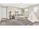 Relaxing living room with neutral tones, comfortable seating, and natural light at 4777 E Summerfield Dr, Camby, IN 46113
