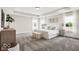 This spacious main bedroom includes neutral decor, tray ceiling, and lots of natural light at 4777 E Summerfield Dr, Camby, IN 46113