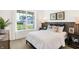 Bright bedroom featuring a large window with neighborhood views and neutral decor at 5035 Astor Ct, McCordsville, IN 46055