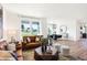 Open-concept living room with large windows and a view of the dining area and backyard at 5035 Astor Ct, McCordsville, IN 46055