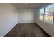 Bright room with hardwood floors and a large window at 5210 Cartland Dr, Indianapolis, IN 46239