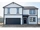 Two-story home featuring black accents and an attached two-car garage at 5210 Cartland Dr, Indianapolis, IN 46239