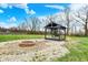 Fire pit and swing hanging from a gazebo in the backyard of this home at 5371 Lue Ann Ln, Mooresville, IN 46158