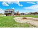 Expansive backyard featuring a fire pit, pool, and screened-in porch perfect for outdoor entertaining at 5371 Lue Ann Ln, Mooresville, IN 46158