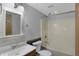 This bathroom includes a vanity with a framed mirror, toilet, and shower/tub combo at 5371 Lue Ann Ln, Mooresville, IN 46158