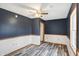 Well-lit bedroom with modern flooring, neutral walls, and a comfortable layout, creating a tranquil and inviting space at 5371 Lue Ann Ln, Mooresville, IN 46158