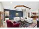 Open-concept living room with stylish furnishings, carpet, and a seamless transition to the kitchen and dining areas at 5371 Lue Ann Ln, Mooresville, IN 46158