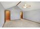 Large bedroom with grey walls, light carpet, a ceiling fan, and two doors at 5371 Lue Ann Ln, Mooresville, IN 46158