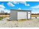 Durable metal outbuilding provides secure storage with roll-up door and convenient side access at 5371 Lue Ann Ln, Mooresville, IN 46158