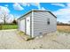 Sturdy metal outbuilding offers extra storage space with a door and window at 5371 Lue Ann Ln, Mooresville, IN 46158