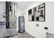 Functional utility room with modern appliances and minimalist wall art at 5803 Sunstone Rd, Indianapolis, IN 46239