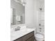 Clean and bright bathroom featuring a vanity with dark wood cabinets and a shower-tub combination at 5832 Lyster Ln, Indianapolis, IN 46239