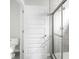 Well-lit bathroom featuring a glass shower and modern toilet at 5832 Lyster Ln, Indianapolis, IN 46239