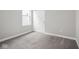 A bright and airy bedroom with neutral carpeting and a closet with sliding doors at 5832 Lyster Ln, Indianapolis, IN 46239