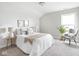 Stylishly decorated bedroom with modern wallpaper, comfortable furniture, and natural light at 5832 Lyster Ln, Indianapolis, IN 46239