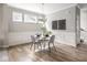 Cozy dining area with modern chairs, a table setting, and stylish wall decor at 5832 Lyster Ln, Indianapolis, IN 46239