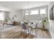 Inviting dining area with a modern table set, natural light, and neutral decor at 5832 Lyster Ln, Indianapolis, IN 46239