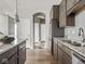 Bright kitchen with granite countertops, stainless steel refrigerator, and lots of cabinet space at 5832 Lyster Ln, Indianapolis, IN 46239