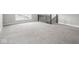 Neutral upstairs living area featuring plush carpeting and a staircase at 5832 Lyster Ln, Indianapolis, IN 46239