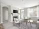Comfortable living room with a fireplace, plush seating, and a stylish area rug at 5832 Lyster Ln, Indianapolis, IN 46239