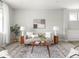 Bright living room with neutral decor, a decorative rug, and lots of natural light at 5832 Lyster Ln, Indianapolis, IN 46239