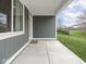 An inviting covered patio offers views of the spacious, well-maintained backyard at 5832 Lyster Ln, Indianapolis, IN 46239