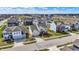 Bird's-eye view of a residential community, highlighting a mix of homes, green spaces, and connected streets at 6075 Meadowview Dr, Whitestown, IN 46075