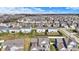 Wide aerial perspective of a planned community, revealing organized homes, green areas, and systematic roads at 6075 Meadowview Dr, Whitestown, IN 46075