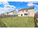 Spacious backyard with a wooden fence, garden beds, and well-maintained lawn offers a serene outdoor space at 6075 Meadowview Dr, Whitestown, IN 46075