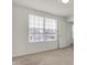 Bright bedroom featuring neutral carpet, white walls, and a large window with neighborhood view at 6075 Meadowview Dr, Whitestown, IN 46075