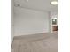 Empty bedroom featuring neutral carpet and white walls with an ensuite bathroom at 6075 Meadowview Dr, Whitestown, IN 46075