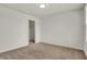 A spacious bedroom features neutral carpet and a closet with ample storage at 6075 Meadowview Dr, Whitestown, IN 46075