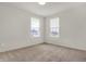Bedroom featuring neutral paint and two bright windows at 6075 Meadowview Dr, Whitestown, IN 46075
