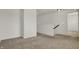 Second floor hallway is carpeted and has a nearby doorway at 6075 Meadowview Dr, Whitestown, IN 46075