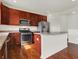 Well-equipped kitchen features stainless steel appliances and granite countertops at 6075 Meadowview Dr, Whitestown, IN 46075