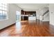 Open floor plan with hardwood floors and a view of the kitchen, stairs, and dining area at 6075 Meadowview Dr, Whitestown, IN 46075
