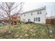 Spacious backyard with a well-maintained lawn, a playset, and a patio area at 6345 Meadowview Dr, Whitestown, IN 46075