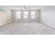 Spacious bedroom with a rainbow mural on the wall and plush carpet flooring at 6345 Meadowview Dr, Whitestown, IN 46075