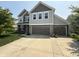 Charming two-story home with a three-car garage and well-manicured lawn, providing great curb appeal at 6345 Meadowview Dr, Whitestown, IN 46075