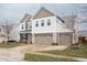 Charming two-story home with three-car garage, brick accents, and a well-manicured lawn at 6345 Meadowview Dr, Whitestown, IN 46075