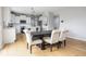 Bright kitchen and dining area with stainless steel appliances and stylish modern decor and light hardwood floors at 6345 Meadowview Dr, Whitestown, IN 46075