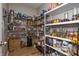 Well-organized walk-in pantry with ample shelving and storage for food items and supplies at 6345 Meadowview Dr, Whitestown, IN 46075